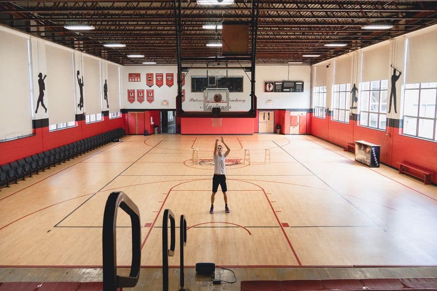 Player practicing in a basketball gym