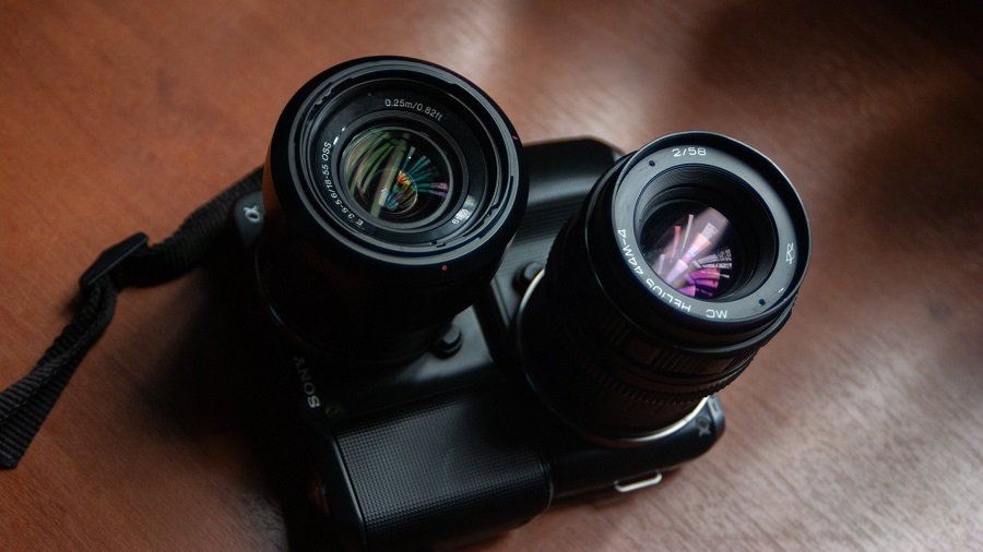Two vintage camera lenses on a table