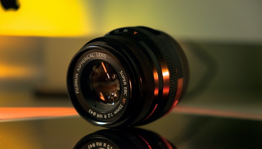 A Fujinon 35mm lens on glass surface