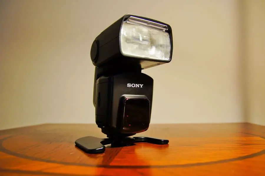A sony flash on a wooden table