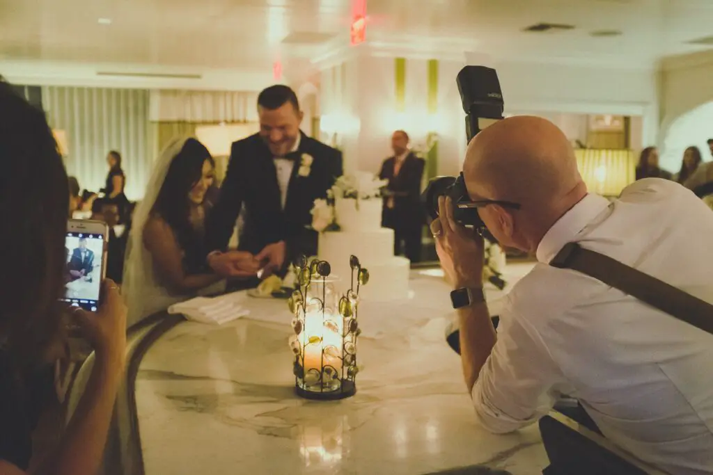 A photographer shooting the couple in a wedding