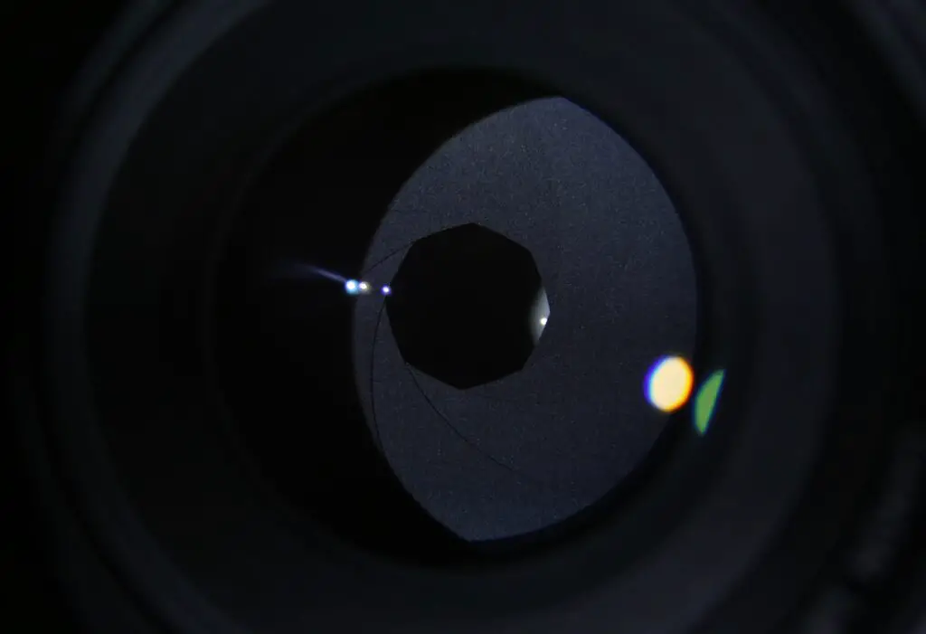 A dark close up shot of aperture blades inside the lens