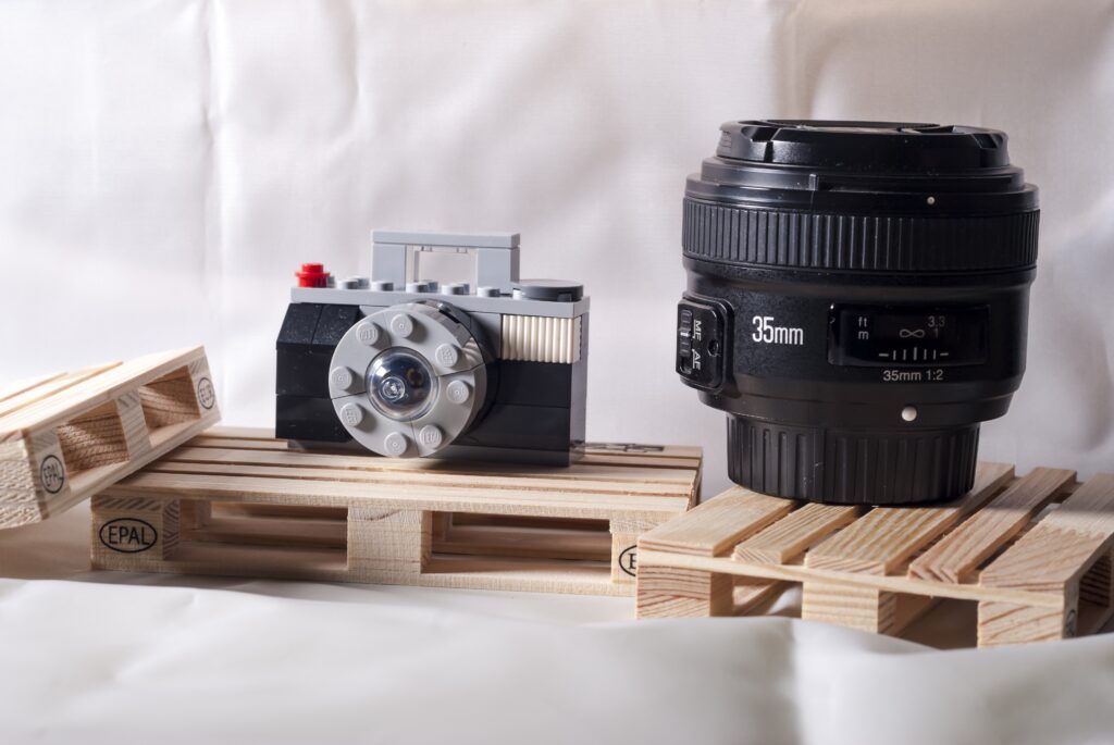 A 35mm lens and a lego of a camera on display