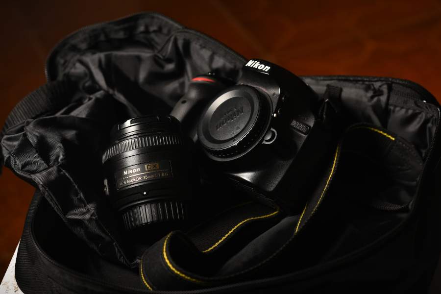 Nikon D3200 camera and lens inside a bag