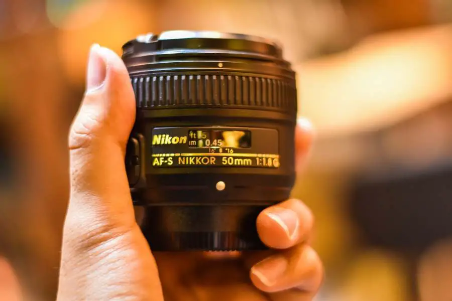 Close up shot of a Nikon D5000 lens for shooting portraits