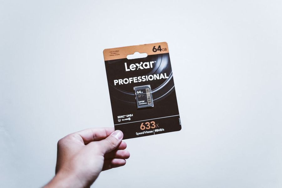 Hand holding an SDXC card package
