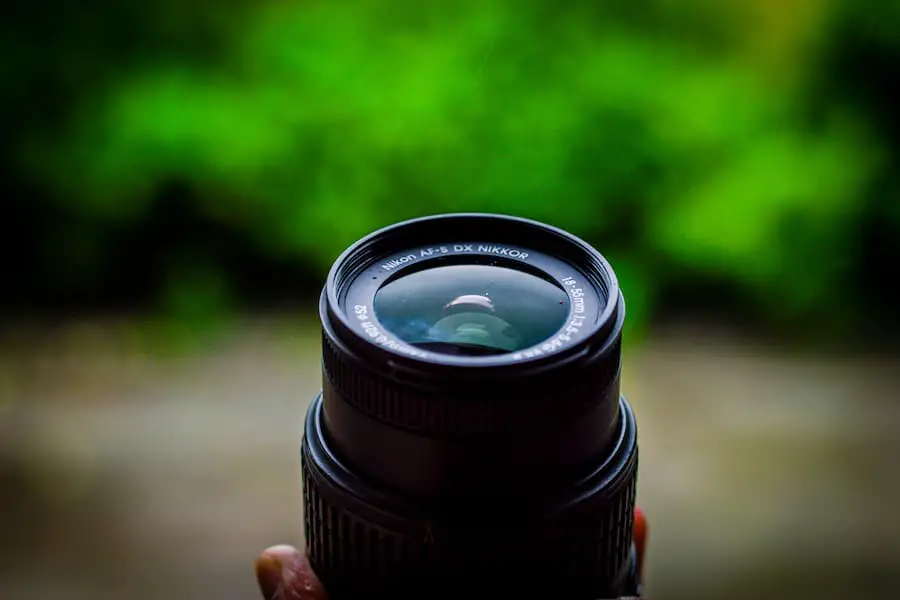 Camera lens holding by a man