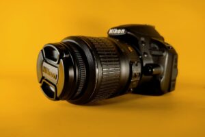 High-quality Nikon camera on yellow background