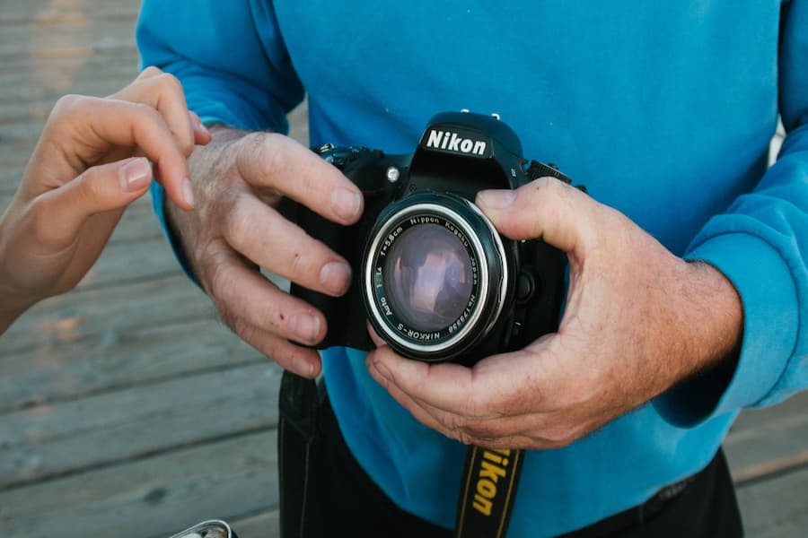 Nikon D5300 camera holding buy a man