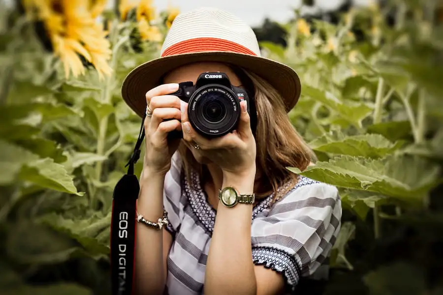 Woman holding a camera with STM lens