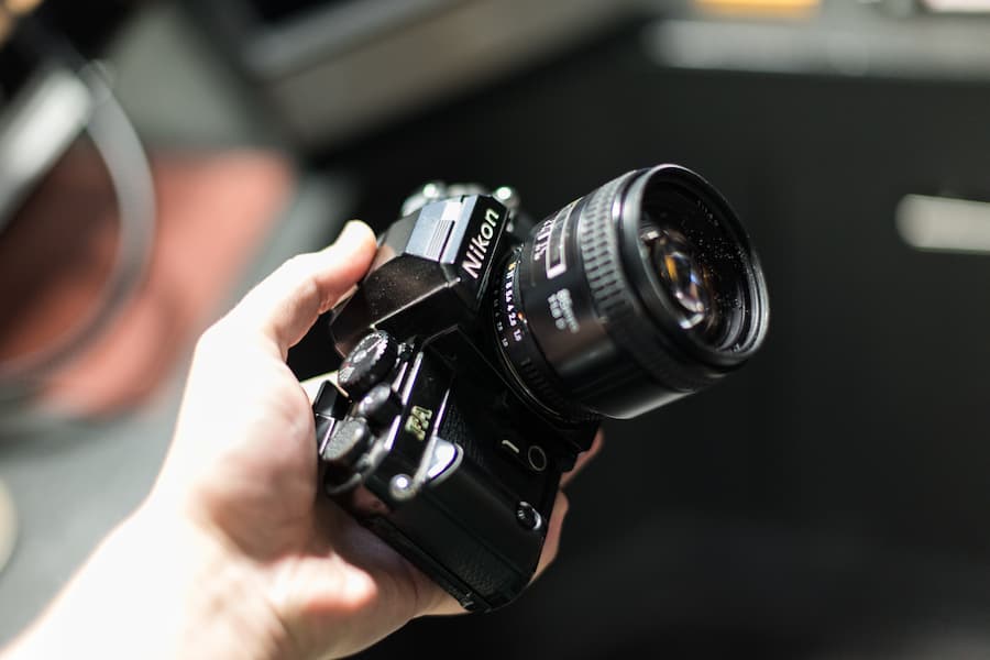 Nikon dslr camera holding by a man