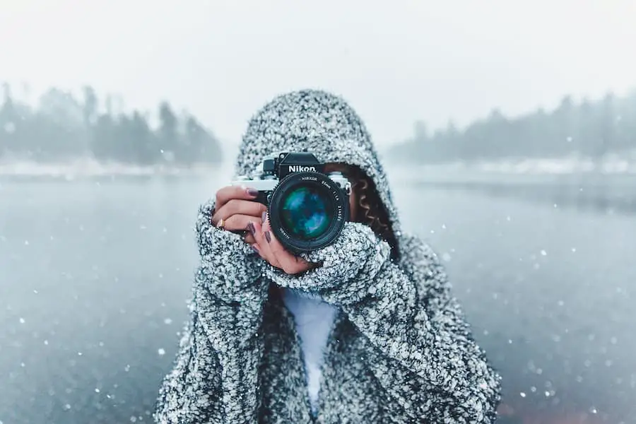 Nikon DSLR camera handling by a woman in winter